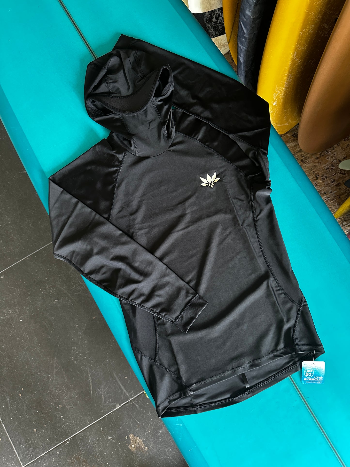 Complete front view of AXXE Classic hooded rashguard designed for surfers, with hood and UPF50+ coverage.